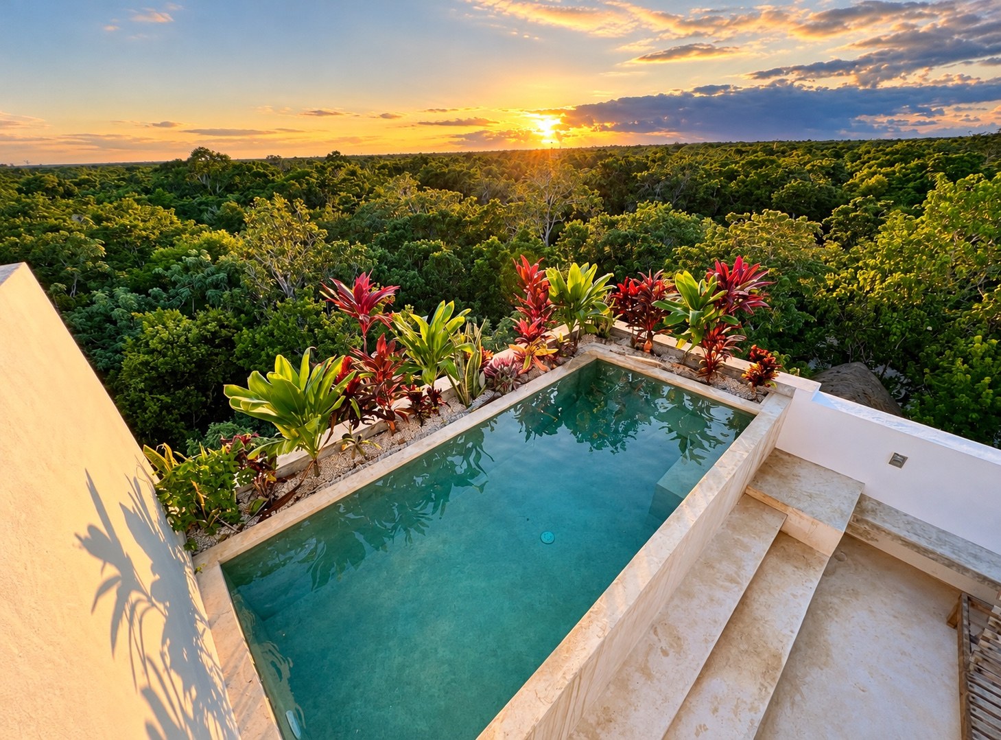 Private rooftop pool overlooking the jungle at sunset