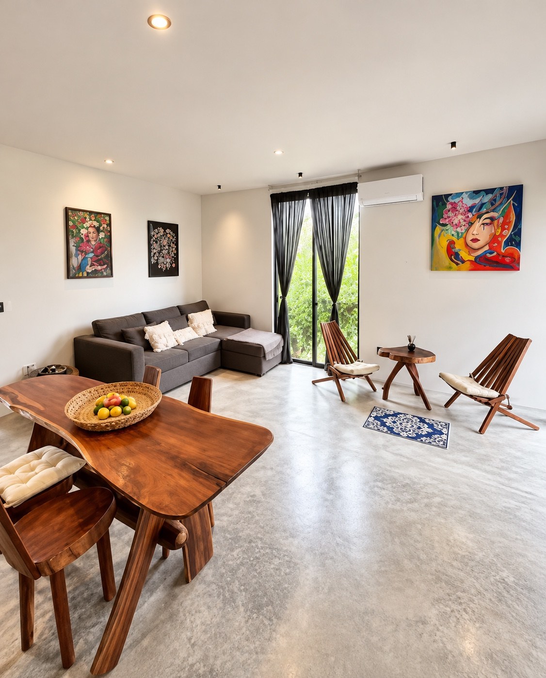 Living and dining room with sofa and wooden furniture
