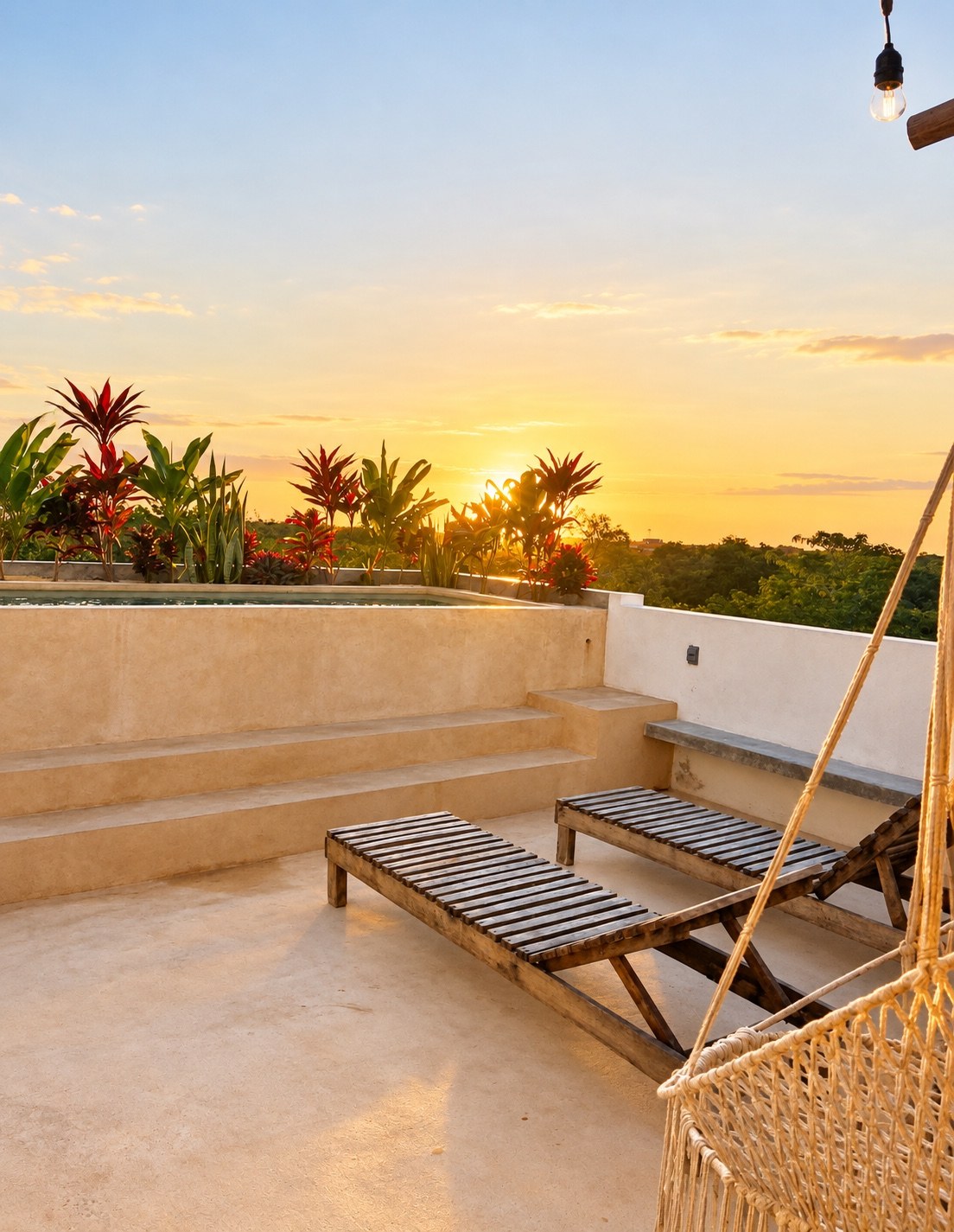 Private rooftop terrace with loungers at sunset